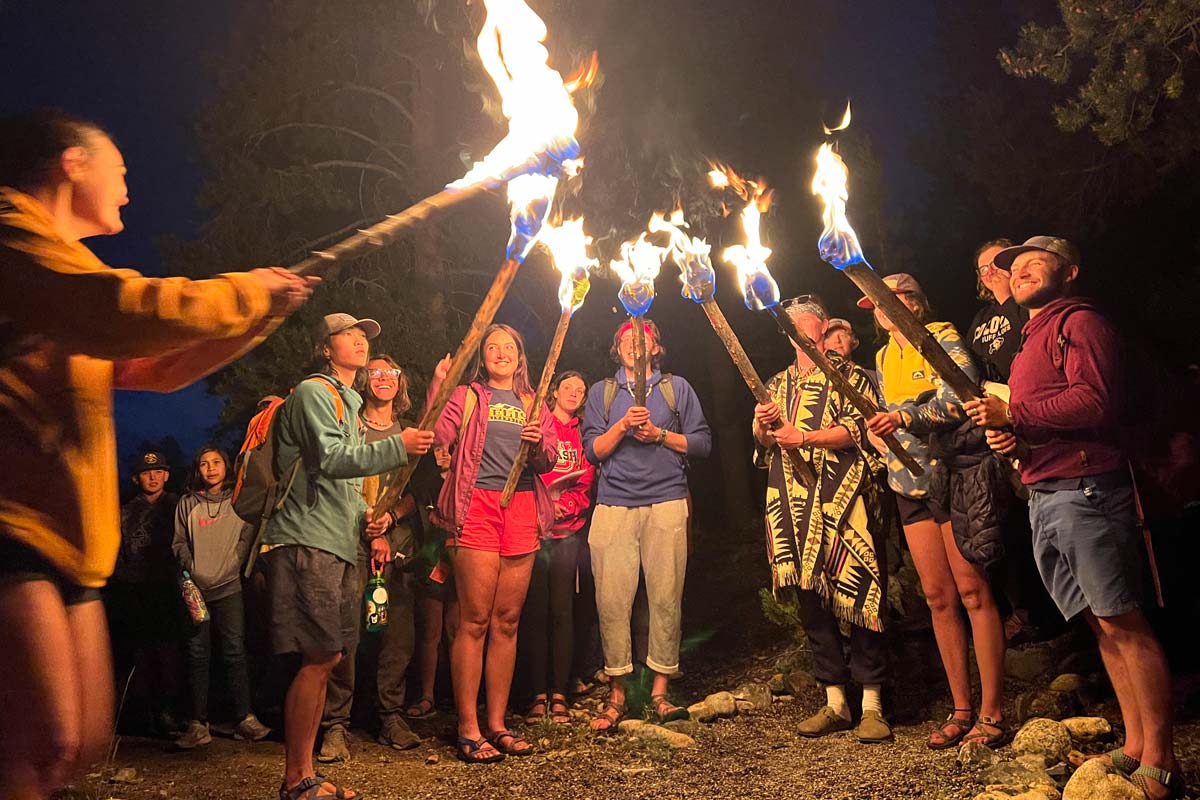 Discovery Camp counselors light the torches during the Celebration Ceremony