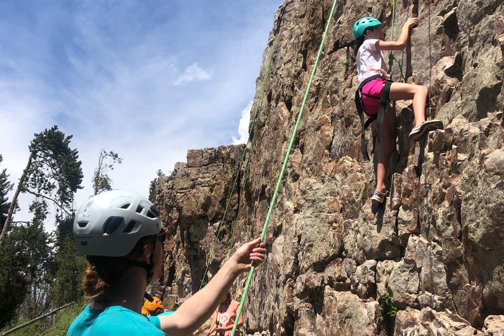 Pathfinders student rock climbing