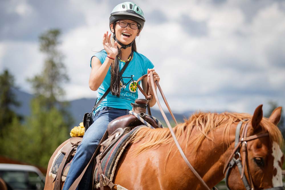 Pathfinders camper riding horseback!