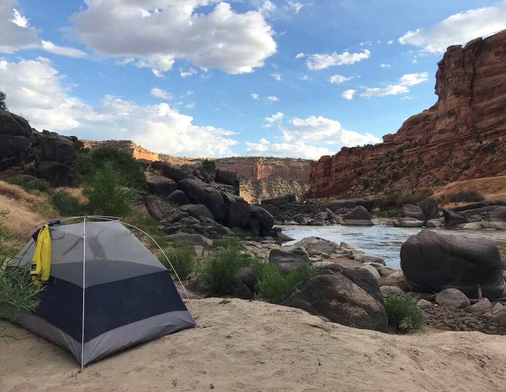 Camping by the riverside.