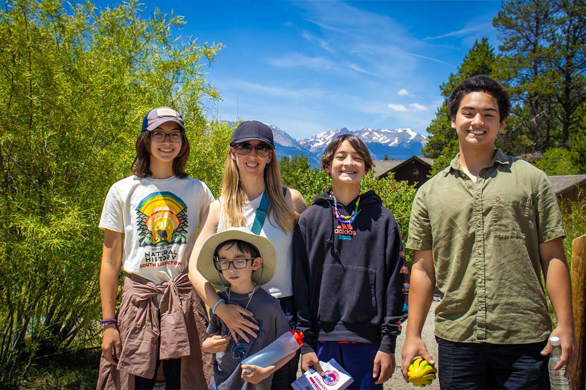 A family dropping off their campers at check-in