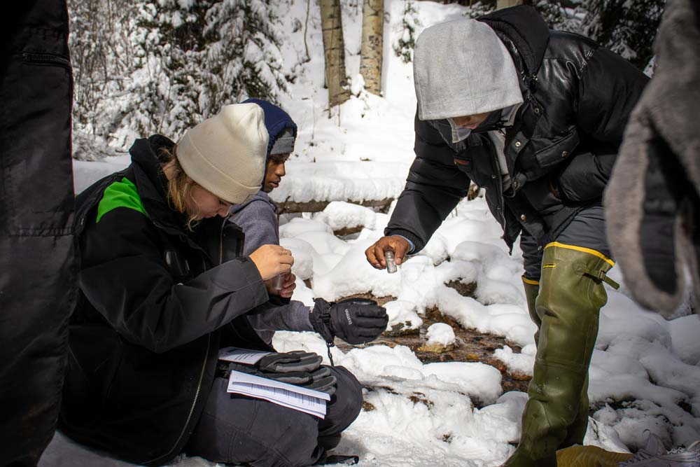 H2O Outdoors students performing water ecology measurments.