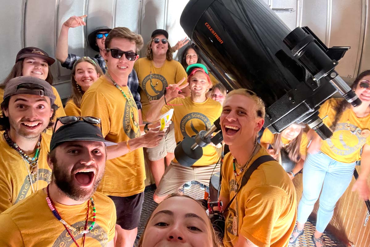 Summer Counselors smiling in the Observatory