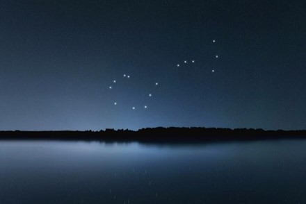 Starlight sky over an alpine lake
