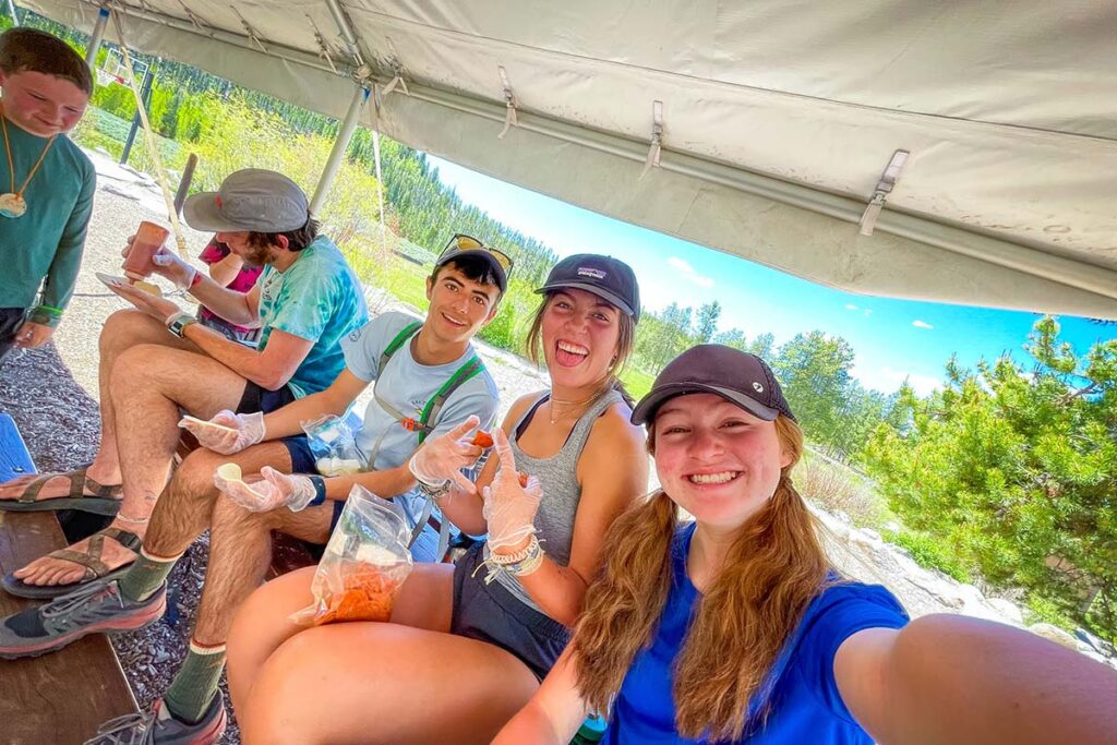 The CAPs helping counselors prepare food for campers