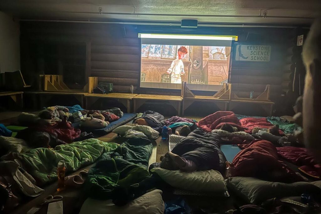 Watching a movie during the Day Camp Overnight