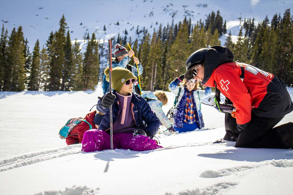 A A-Basin ski patroller mentoring a Girls in STEM student