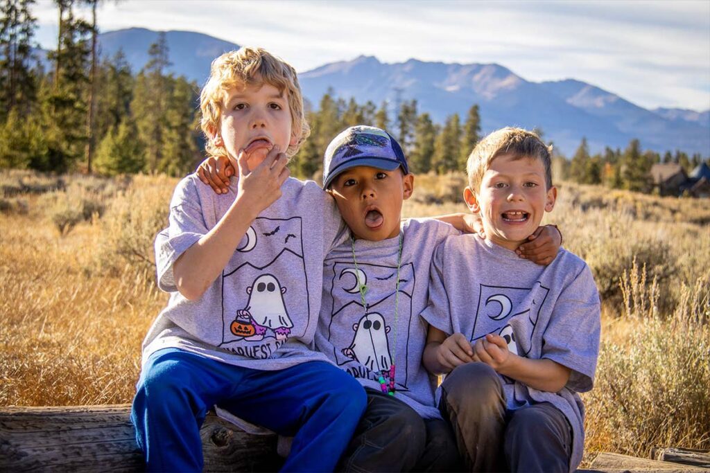 Three campers making funny faces during a Harvest Camp hike