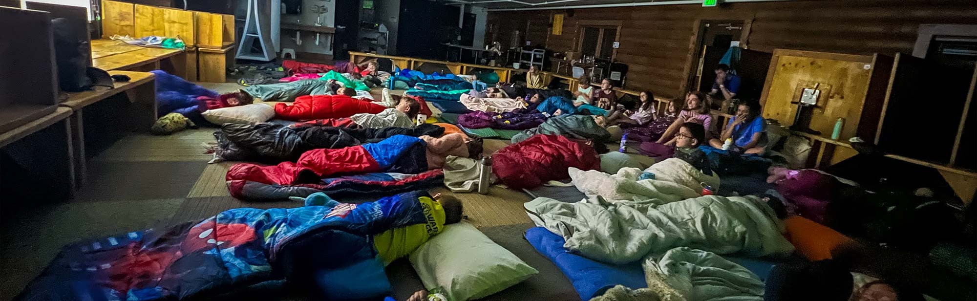 Campers watch a movie during the Day Camp Overnight