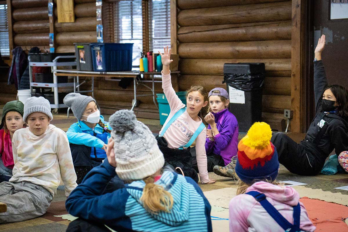 A student raises her hand during Girls in STEM Water in the West